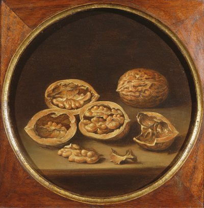 A Still Life of Cracked Walnuts resting on a Stone Ledge by Antonio Pereda y Salgado